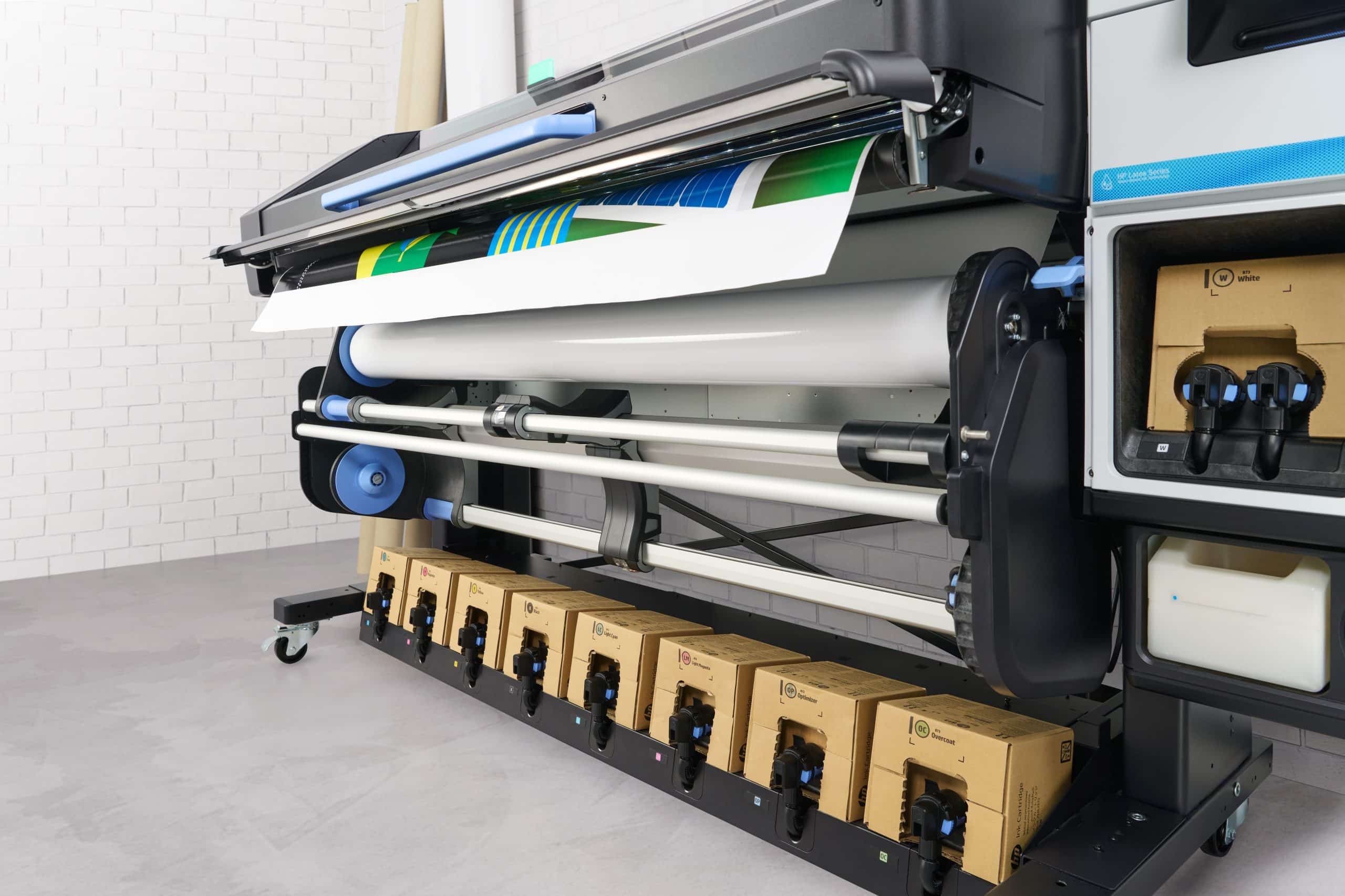 The HP Latex 830W wide-format printer with a print coming off the roll