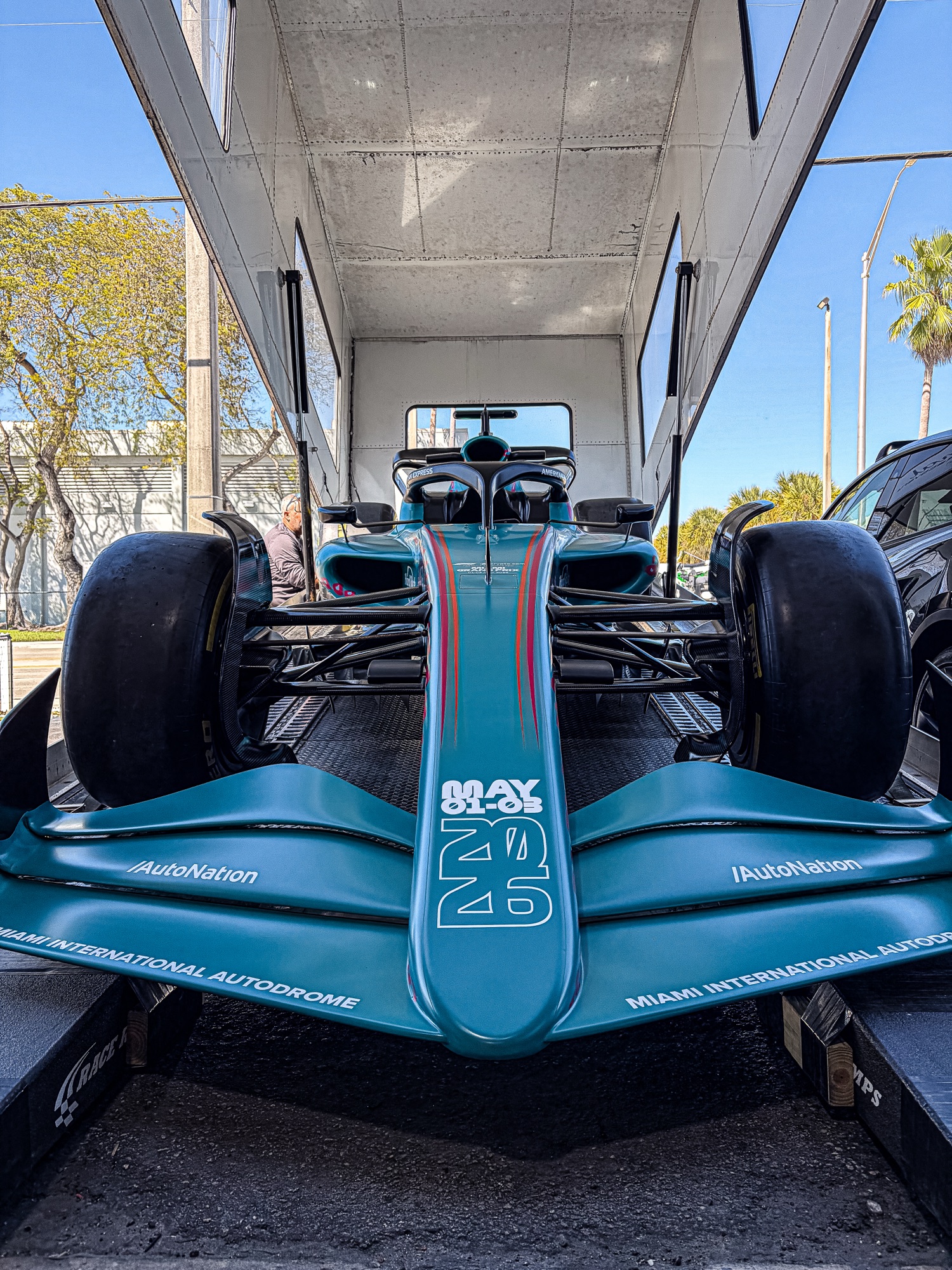 Formula 1 show car being loaded for delivery, front-on view