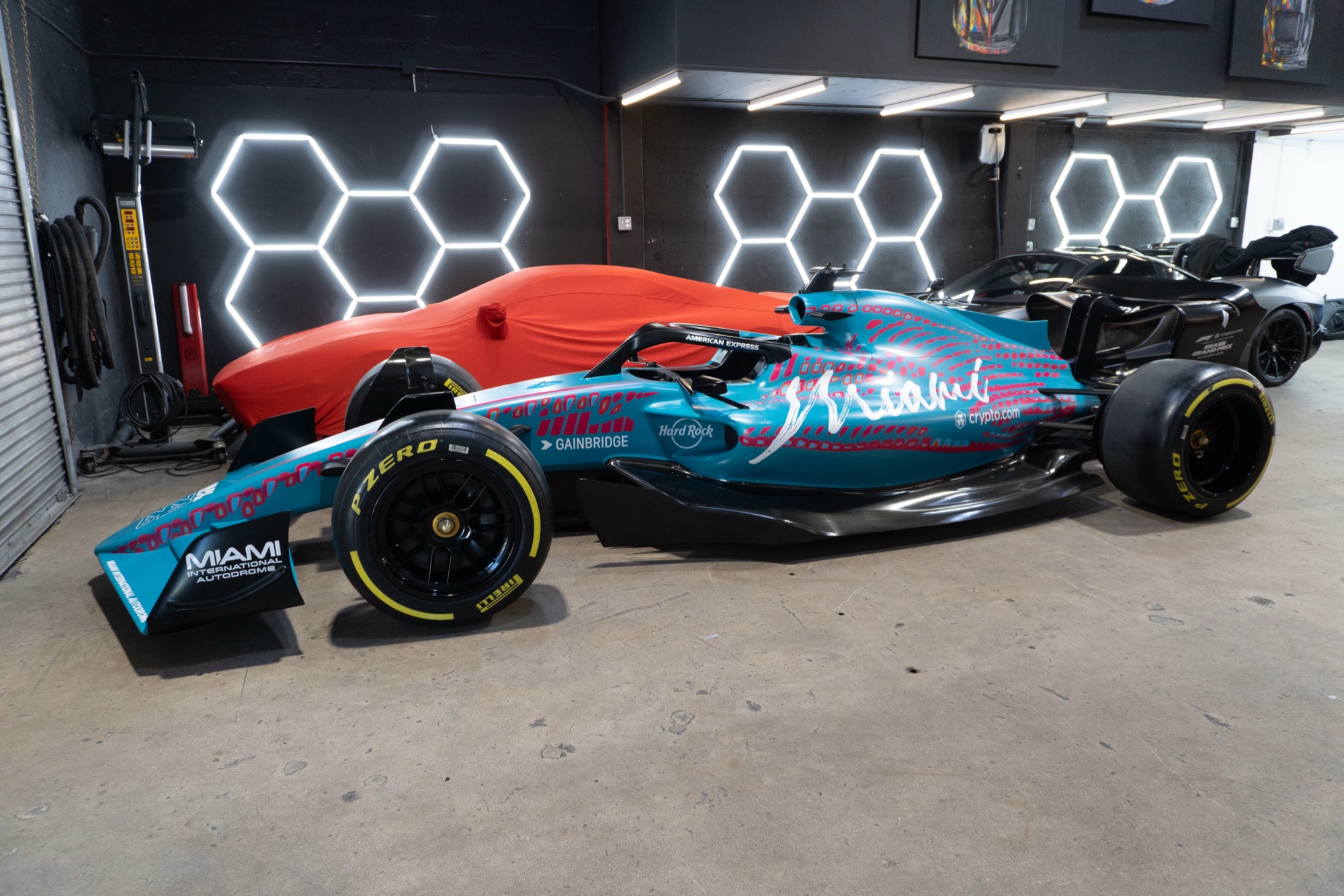 Formula 1 show car wrapped in Miami Grand Prix livery in a showroom