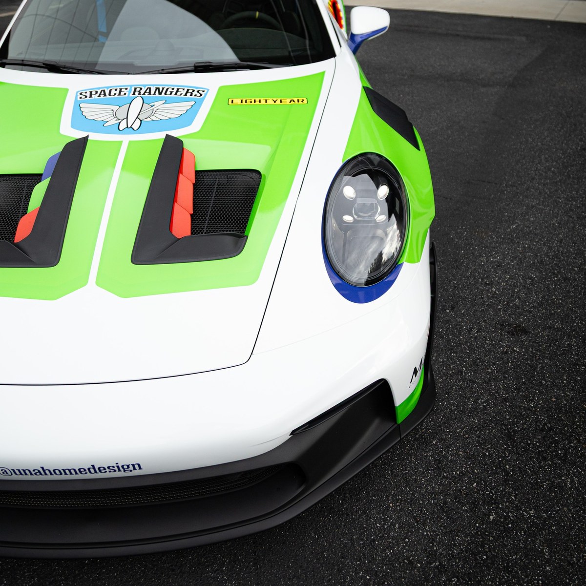 Close-up of the hood graphics and headlight on the wrapped GT3 RS